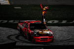DAYTONA BEACH, FL - FEBRUARY 14:  Jamie McMurray climbs on top of his #1 Bass Tracker Chevrolet to celebrate winning the NASCAR Sprint Cup Series Daytona 500 at Daytona International Speedway on February 14, 2010 in Daytona Beach, Florida.  (Photo by Sam Greenwood/Getty Images)