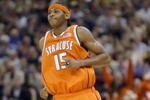 NEW ORLEANS - APRIL 7:  Carmelo Anthony #15 of Syracuse smiles after making a basket against the Kansas defense during the championship game of the NCAA Men's Final Four Tournament on April 7, 2003 at the Louisiana Superdome in New Orleans, Louisiana.  (Photo by Craig Jones/Getty Images)