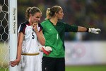 BEIJING - AUGUST 21:  Lindsay Tarpley #5 of United States awaits a corner as goalkeeper, Hope Solo #1 organises her defence during the Women's Football Gold Medal match between Brazil and the United States on Day 13 of the Beijing 2008 Olympic Games on August 21, 2008 at Worker's Stadium in Beijing, China.  (Photo by Mike Hewitt/Getty Images)
