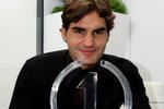 LONDON, ENGLAND - NOVEMBER 25:  Roger Federer of Switzerland poses with the ATP World Tour Champion Trophy during the Barclays ATP World Tour Finals at the O2 Arena on November 25, 2009 in London, England.  Federer was crowned ATP World Tour Champion for the fifth time, after becoming just the second player in the history of the ATP Rankings to regain the year-end No. 1 ranking. Federer clinched the 2009 ATP World Tour Champion title by beating Andy Murray at the Barclays ATP World Tour Finals on November 24.  (Photo by Julian Finney/Getty Images)