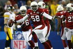 TAMPA, FL - FEBRUARY 01:  Karlos Dansby #58 of the Arizona Cardinals reacts after an inteception in the second quarter against the Pittsburgh Steelers during Super Bowl XLIII on February 1, 2009 at Raymond James Stadium in Tampa, Florida.  (Photo by Al Bello/Getty Images)