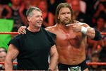 LAS VEGAS - AUGUST 24:  World Wrestling Entertainment Inc. Chairman Vince McMahon (L) and wrestler Triple H appear in the ring during the WWE Monday Night Raw show at the Thomas & Mack Center August 24, 2009 in Las Vegas, Nevada.  (Photo by Ethan Miller/Getty Images)