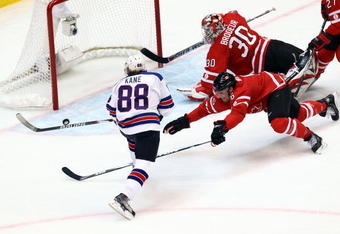 VANCOUVER, BC - FEBRUARY 21:  Goalkeeper Martin Brodeur #30 of Canada tries to catch the puck during the ice hockey men's preliminary game between Canada and USA on day 10 of the Vancouver 2010 Winter Olympics at Canada Hockey Place on February 21, 2010 in Vancouver, Canada.  (Photo by Alex Livesey/Getty Images)