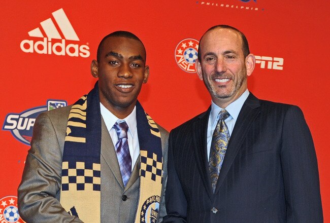 PHILADELPHIA - JANUARY 14: First-round draft pick Amobi Okugo (L) of the Philadelphia Union and Major League Soccer commissioner Don Garber pose for a photograph during the 2010 MLS SuperDraft on January 14, 2010 at the Pennsylvania Convention Center in Philadelphia, Pennsylvania. (Photo by Drew Hallowell/Getty Images)