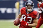 HOUSTON - SEPTEMBER 27:  Wide receiver Kevin Walter #83 of the Houston Texans runs with the ball after a reception against the Jacksonville Jaguars at Reliant Stadium on September 27, 2009 in Houston, Texas.  (Photo by Bob Levey/Getty Images)