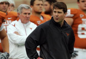 AUSTIN, TX - OCTOBER 10:  Defensive coordinator Will Muschamp and head coach Mack Brown of the Texas Longhorns lead their team in pregame drills before playing the Colorado Buffaloes  on October 10, 2009 at Darrell K Royal-Texas Memorial Stadium in Austin, Texas.  Texas won 38-14.  (Photo by Brian Bahr/Getty Images)