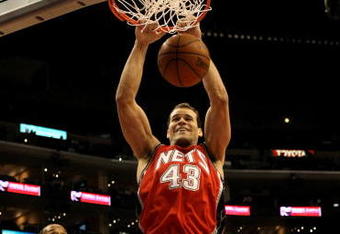 LOS ANGELES - JANUARY 18:   Chris Humphries #43 of the New Jersey Nets dunks over Marcus Camby #23 of the Los Angeles Clippers on January 18, 2010 at Staples Center in Los Angeles, California. The Clippers won 106-95.  NOTE TO USER: User expressly acknowledges and agrees that, by downloading and/or using this Photograph, user is consenting to the terms and conditions of the Getty Images License Agreement. (Photo by Stephen Dunn/Getty Images)