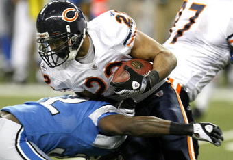 DETROIT - JANUARY 03: Matt Forte #22 of the Chicago Bears is tackled during a fourth quarter run by Anthony Henry #32 of the Detroit Lions on January 3, 2010 at Ford Field in Detroit, Michigan. Chicago won the game 37-23. (Photo by Gregory Shamus/Getty Images)
