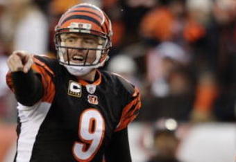 CINCINNATI - JANUARY 9:  Quarterback Carson Palmer #9 of the Cincinnati Bengals signals at the line of scrimmage against the New York Jets during the 2010 AFC wild-card playoff game at Paul Brown Stadium on January 9, 2010 in Cincinnati, Ohio. (Photo by Andy Lyons/Getty Images)