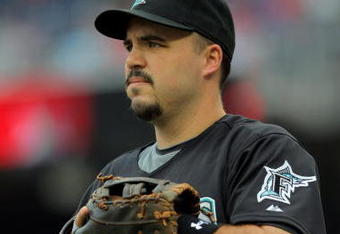WASHINGTON - AUGUST 06:  First baseman Nick Johnson #20 of the Florida Marlins prepares to take the field against the Washington Nationals at Nationals Park on August 6, 2009 in Washington, DC. The Nationals defeated the Marlins 12-8.  (Photo by Doug Pensinger/Getty Images)