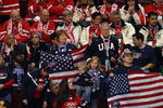 VANCOUVER, BC - FEBRUARY 22: USA fans wave flags in front of Canadian fans during the ice hockey women's semifinal game between Sweden and USA on day 11 of the Vancouver 2010 Winter Olympics at Canada Hockey Place on February 22, 2010 in Vancouver, Canada.  (Photo by Cameron Spencer/Getty Images)