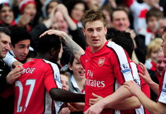 LONDON, ENGLAND - FEBRUARY 20:  Goalscorer Nicklas Bendtner of Arsenal thanks team mate Emmanuel Eboue for the cross during the Barclays Premiere League match between Arsenal and Sunderland at Emirates Stadium on February 20, 2010 in London, England.  (Photo by Mike Hewitt/Getty Images)