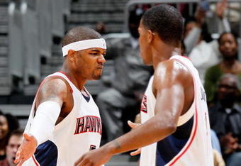 ATLANTA - JANUARY 29:  Josh Smith #5 and Joe Johnson #2 of the Atlanta Hawks against the Boston Celtics at Philips Arena on January 29, 2010 in Atlanta, Georgia.  NOTE TO USER: User expressly acknowledges and agrees that, by downloading and/or using this Photograph, User is consenting to the terms and conditions of the Getty Images License Agreement.  (Photo by Kevin C. Cox/Getty Images)