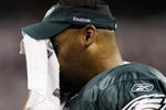 ARLINGTON, TX - JANUARY 9:  Quarterback Donovan McNabb #5 of the Philadelphia Eagles wipes his face from the sideline in the second quarter against the Dallas Cowboys during the 2010 NFC wild-card playoff game at Cowboys Stadium on January 9, 2010 in Arlington, Texas. (Photo by Jamie Squire/Getty Images)