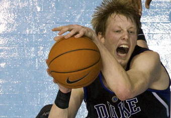 CHAPEL HILL, NC - FEBRUARY 10: Duke forward Kyle Singler #12 pulls down a rebound against North Carolina during a men's college basketball game at Dean Smith Center on February 10, 2010 in Chapel Hill, North Carolina. (Photo by Chris Keane/Getty Images)