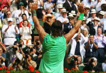 PARIS - JUNE 08:  Rafael Nadal of Spain waves to the fans following his victory during the Men's Singles Final match against Roger Federer of Switzerland on day fifteen of the French Open at Roland Garros on June 8, 2008 in Paris, France.  (Photo by Julian Finney/Getty Images)