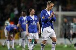 LISBON, PORTUGAL - FEBRUARY 25:  Phil Neville of Everton looks dejected after losing to Sporting after the UEFA Europa League Round of 32, 2nd leg match between Sporting Lisbon and Everton at the Estadio Jose Alvalade on February 25, 2010 in Lisbon, Portugal.  (Photo by Julian Finney/Getty Images)