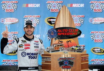 FONTANA, CA - FEBRUARY 21:  Jimmie Johnson, driver of the #48 Lowe's/Kobalt Tools Chevrolet, celebrates in victory lane with the trophy after winning the NASCAR Sprint Cup Series Auto Club 500 at Auto Club Speedway on February 21, 2010 in Fontana, California.  (Photo by Jason Smith/Getty Images for NASCAR)