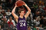 INDIANAPOLIS - MARCH 12:  John Shurna #24 of the Northwestern Wildcats looks to pass the ball against the Minnesota Golden Gophers during the first round of the Big Ten Men's Basketball Tournament at Conseco Fieldhouse on March 12, 2009 in Indianapolis, Indiana.  (Photo by Jonathan Daniel/Getty Images)