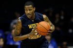 ROSEMONT, IL - JANUARY 26: Devin Ebanks #3 of the West Virginia Mountaineers brings the ball up court against the DePaul Blue Demons at the Allstate Arena on January 26, 2010 in Rosemont, Illinois. West Virginia defeated DePaul 62-46. (Photo by Jonathan Daniel/Getty Images)