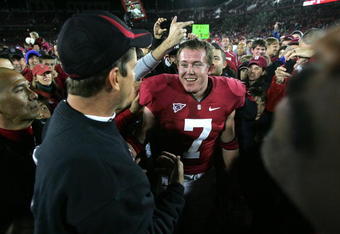 PALO ALTO, CA - NOVEMBER 28:  Toby Gerhart #7 of the Stanford Cardinal is congratulated by head coach Jim Harbaugh after they beat the Notre Dame Fighting Irish at Stanford Stadium on November 28, 2009 in Palo Alto, California.  (Photo by Ezra Shaw/Getty Images)