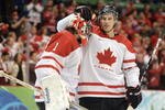 VANCOUVER, BC - FEBRUARY 26:  Goalkeeper Roberto Luongo #1 of Canada celebrates with his team mate Ryan Getzlaf #51 of Canada after Canada won the ice hockey men's semifinal game between the Canada and Slovakia on day 15 of the Vancouver 2010 Winter Olympics at Canada Hockey Place on February 26, 2010 in Vancouver, Canada.  (Photo by Harry How/Getty Images)
