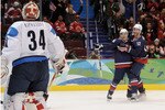 VANCOUVER, BC - FEBRUARY 26:  Ryan Malone #12 of the United States celebrates with his team mate Joe Pavelski #16 after Malone scored past goalkeeper Miikka Kiprusoff #34 of Finland during the ice hockey men's semifinal game between the United States and Finland on day 15 of the Vancouver 2010 Winter Olympics at Canada Hockey Place on February 26, 2010 in Vancouver, Canada.  (Photo by Harry How/Getty Images)