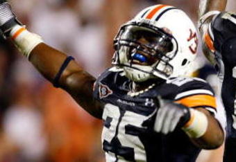 AUBURN, AL - SEPTEMBER 19:  Daren Bates #25 and Josh Bynes #17 of the Auburn Tigers celebrate Bynes interception in the final minutes of their 41-30 win over the West Virginia Mountaineers at Jordan-Hare Stadium on September 19, 2009 in Auburn, Alabama.  (Photo by Kevin C. Cox/Getty Images)