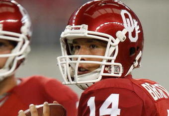 ARLINGTON, TX - SEPTEMBER 05:  Quarterback Sam Bradford #14 of the Oklahoma Sooners warms up before a game against the Brigham Young Cougars at Cowboys Stadium on September 5, 2009 in Arlington, Texas.  (Photo by Ronald Martinez/Getty Images)