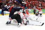 VANCOUVER, BC - FEBRUARY 28:  Dustin Brown #32 of the United States has his shot on goal saved by Roberto Luongo #1 of Canada during the ice hockey men's gold medal game between USA and Canada on day 17 of the Vancouver 2010 Winter Olympics at Canada Hockey Place on February 28, 2010 in Vancouver, Canada.  (Photo by Harry How/Getty Images)