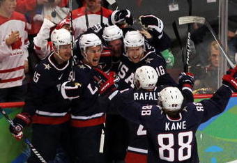 VANCOUVER, BC - FEBRUARY 28:  Zach Parise (2nd L) #9 of the United States celebrates with teammates after scoring a goal to tie the scores 2-2 late in the third during the ice hockey men's gold medal game between USA and Canada on day 17 of the Vancouver 2010 Winter Olympics at Canada Hockey Place on February 28, 2010 in Vancouver, Canada.  (Photo by Jamie Squire/Getty Images)