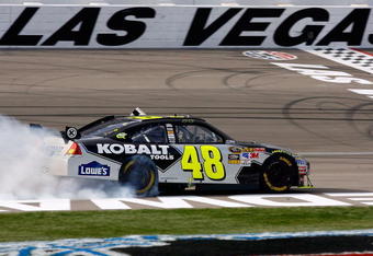 LAS VEGAS - FEBRUARY 28:  Jimmie Johnson, driver of the #48 Lowe's/Kobalt Tools Chevrolet, celebrates by doing a burnout after winning the NASCAR Sprint Cup Series Shelby American at Las Vegas Motor Speedway on February 28, 2010 in Las Vegas, Nevada.  (Photo by Geoff Burke/Getty Images for NASCAR)
