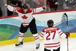 VANCOUVER, BC - FEBRUARY 28:  Sidney Crosby (L) #87 of Canada celebrates with teammate Scott Niedermayer #27 after scoring the matchwinning goal in overtime during the ice hockey men's gold medal game between USA and Canada on day 17 of the Vancouver 2010 Winter Olympics at Canada Hockey Place on February 28, 2010 in Vancouver, Canada.  (Photo by Alex Livesey/Getty Images)