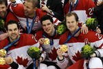 VANCOUVER, BC - FEBRUARY 28:  (L to R) Dan Boyle #22, Sidney Crosby #87 and Chris Pronger #20 of Canada celebrate with the gold medals won during the ice hockey men's gold medal game between USA and Canada on day 17 of the Vancouver 2010 Winter Olympics at Canada Hockey Place on February 28, 2010 in Vancouver, Canada.  (Photo by Bruce Bennett/Getty Images)