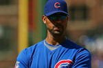 CHICAGO - AUGUST 30: Derrek Lee #25 of the Chicago Cubs waits for a pitching change in the 4th inning of a game against the New York Mets on August 30, 2009 at Wrigley Field in Chicago, Illinois. The Mets defeated the Cubs 4-1. (Photo by Jonathan Daniel/Getty Images)
