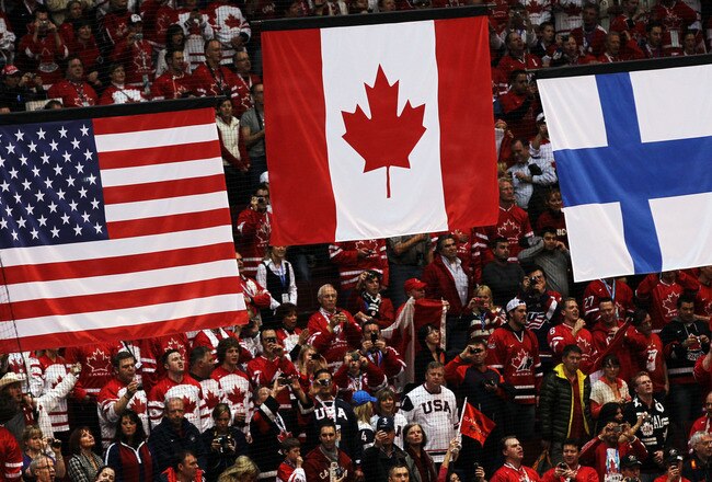 VANCOUVER, BC - FEBRUARY 28:  The flags of the United States, Canada and Finland are raised during the medal ceremony after the ice hockey men's gold medal game between USA and Canada on day 17 of the Vancouver 2010 Winter Olympics at Canada Hockey Place on February 28, 2010 in Vancouver, Canada.  (Photo by Jamie Squire/Getty Images)