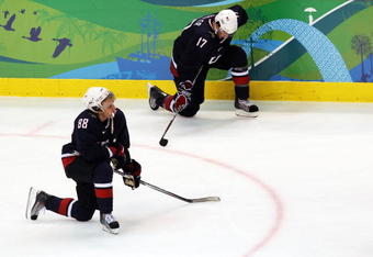 VANCOUVER, BC - FEBRUARY 28:  Dejected Team USA players Patrick Kane #88 and Ryan Kesler #17 take a knee after Sidney Crosby #87 of Canada scored the matchwinning goal in overtime during the ice hockey men's gold medal game between USA and Canada on day 17 of the Vancouver 2010 Winter Olympics at Canada Hockey Place on February 28, 2010 in Vancouver, Canada.  (Photo by Jamie Squire/Getty Images)