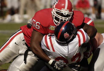 ATHENS, GA - SEPTEMBER 29: Defensive tackle Geno Atkins #56 of the Georgia Bulldogs stops a runner from the Mississippi Rebels at Sanford Stadium on September 29, 2007 in Athens, Georgia.  Georgia won 45 - 17. (Photo by Al Messerschmidt/Getty Images)