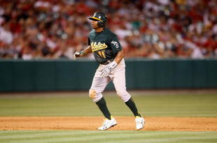 ANAHEIM, CA - AUGUST 29:  Rajai Davis #11 of the Oakland Athletics leads off of second base against the Los Angeles Angels of Anaheim at Angel Stadium on August 29, 2009 in Anaheim, California.  (Photo by Jeff Gross/Getty Images)