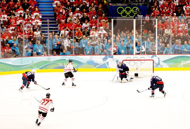VANCOUVER, BC - FEBRUARY 28:  Sidney Crosby #87 of Canada scores the game winning goal against Ryan Miller #39 of the United States in overtime of the ice hockey men's gold medal game between USA and Canada on day 17 of the Vancouver 2010 Winter Olympics at Canada Hockey Place on February 28, 2010 in Vancouver, Canada.  (Photo by Harry How/Getty Images)