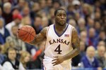 LAWRENCE, KS - FEBRUARY 06: Sherron Collins #4 of the Kansas Jayhawks dribbles the ball downcourt during the game against the Nebraska Cornhuskers on February 6, 2010 at Allen Fieldhouse in Lawrence, Kansas. (Photo by Jamie Squire/Getty Images)