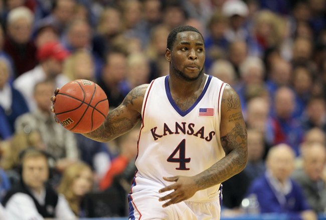 LAWRENCE, KS - FEBRUARY 06: Sherron Collins #4 of the Kansas Jayhawks dribbles the ball downcourt during the game against the Nebraska Cornhuskers on February 6, 2010 at Allen Fieldhouse in Lawrence, Kansas. (Photo by Jamie Squire/Getty Images)