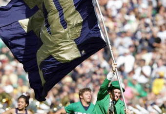 SOUTH BEND, IN - OCTOBER 07:  The mascot of Notre Dame Fighting Irish carries the flag onto the field during the game against the Stanford Cardinal on October 7, 2006 at Notre Dame Stadium in South Bend, Indiana. (Photo by Andy Lyons/Getty Images)
