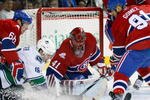 MONTREAL- FEBRUARY 2:  Jaroslav Halak #41 of the Montreal Canadiens stops the puck on an attempt by Steve Bernier #18 of the Vancouver Canucks during the NHL game on February 2, 2010 at the Bell Centre in Montreal, Quebec, Canada.  (Photo by Richard Wolowicz/Getty Images)
