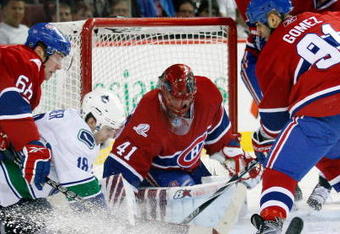 MONTREAL- FEBRUARY 2:  Jaroslav Halak #41 of the Montreal Canadiens stops the puck on an attempt by Steve Bernier #18 of the Vancouver Canucks during the NHL game on February 2, 2010 at the Bell Centre in Montreal, Quebec, Canada.  (Photo by Richard Wolowicz/Getty Images)