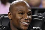 ARLINGTON, TX - FEBRUARY 14:  Boxer Floyd Mayweather takes in the game during the NBA All-Star Game, part of 2010 NBA All-Star Weekend at Cowboys Stadium on February 14, 2010 in Arlington, Texas. The Eastern Conference defeated the Western Conference 141-139 in regulation.NOTE TO USER: User expressly acknowledges and agrees that, by downloading and or using this photograph, User is consenting to the terms and conditions of the Getty Images License Agreement.  (Photo by Jed Jacobsohn/Getty Images)