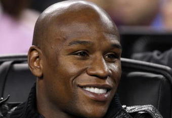 ARLINGTON, TX - FEBRUARY 14:  Boxer Floyd Mayweather takes in the game during the NBA All-Star Game, part of 2010 NBA All-Star Weekend at Cowboys Stadium on February 14, 2010 in Arlington, Texas. The Eastern Conference defeated the Western Conference 141-139 in regulation.NOTE TO USER: User expressly acknowledges and agrees that, by downloading and or using this photograph, User is consenting to the terms and conditions of the Getty Images License Agreement.  (Photo by Jed Jacobsohn/Getty Images)
