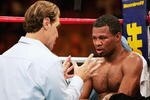 LAS VEGAS - NOVEMBER 20:  Trainer Joe Goosen talks with Shane Mosley between rounds against Winky Wright during the WBC/WBA Super Welterweight Championship at Mandalay Bay Resort and Casino on November 20, 2004 in Las Vegas, Nevada. Wright defeated Mosley in a majority decision.  (Photo by Al Bello/Getty Images)