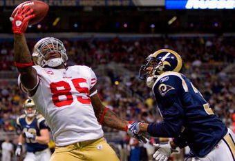 ST. LOUIS - JANUARY 3: Vernon Davis #85 of the San Francisco 49ers attempts to make a catch against Justin King #31 of the St. Louis Rams at the Edward Jones Dome on January 3, 2010 in St. Louis, Missouri.  (Photo by Dilip Vishwanat/Getty Images)