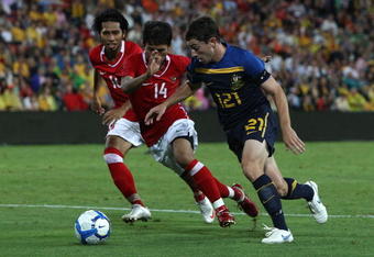 BRISBANE, AUSTRALIA - MARCH 03: Thomas Oar of Australia is pressured by his opponent during the Asian Cup Group B qualifying match between the Australian Socceroos and Indonesia at Suncorp Stadium on March 3, 2010 in Brisbane, Australia.  (Photo by Robert Cianflone/Getty Images)
